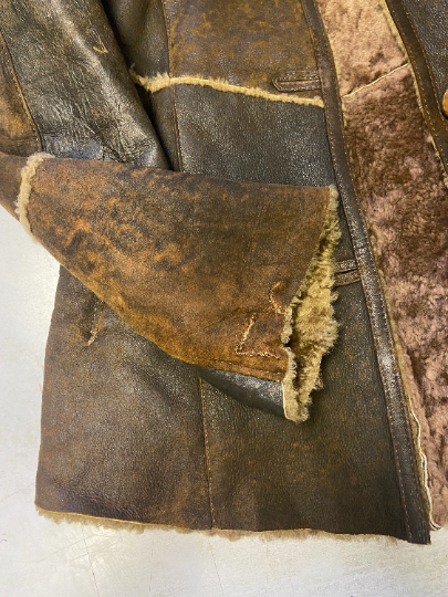 Vintage 90's Women Distressed Sheepskin Jacket in Brown