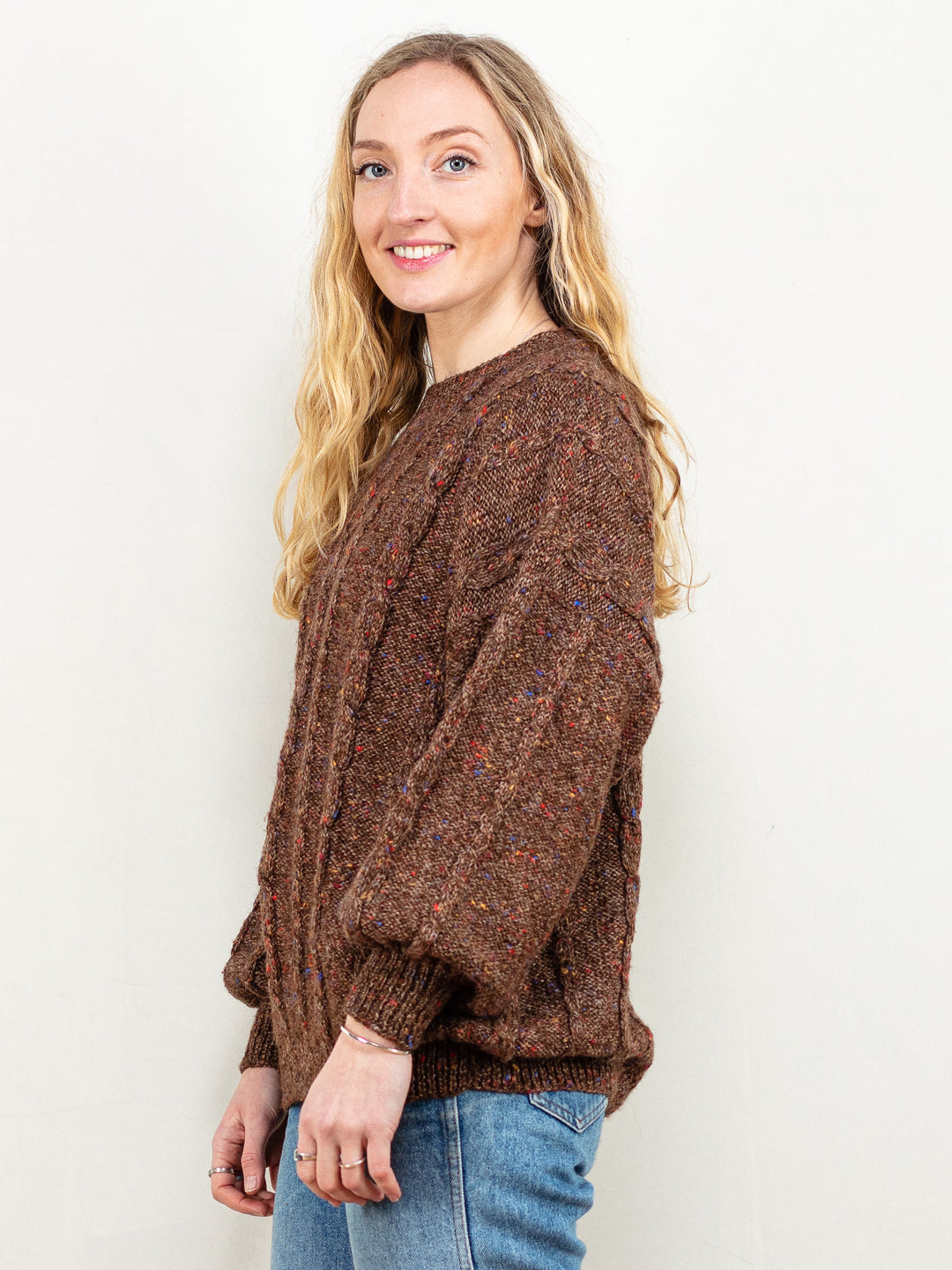 This is a vintage 80's/ 90's hand-knit sweater in brown. Seems to be made of an acrylic blend, because of the soft touch.