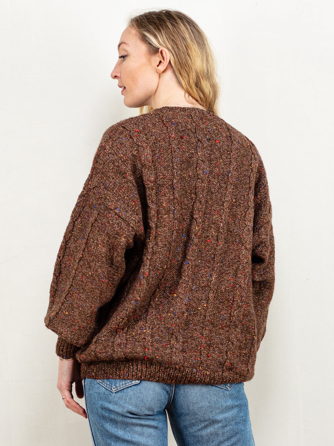 This is a vintage 80's/ 90's hand-knit sweater in brown. Seems to be made of an acrylic blend, because of the soft touch.
